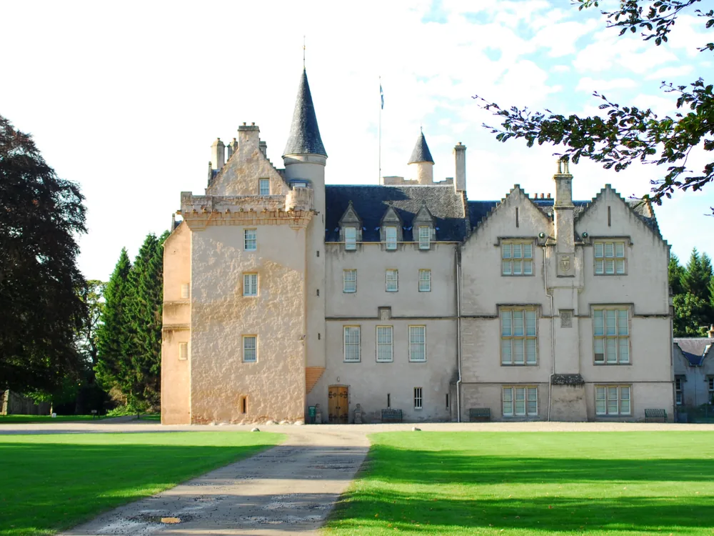 Brodie Castle — the National Trust for Scotland's 16th-century Z-plan tower house surrounded by its famous daffodil display in spring, Moray, Scotland