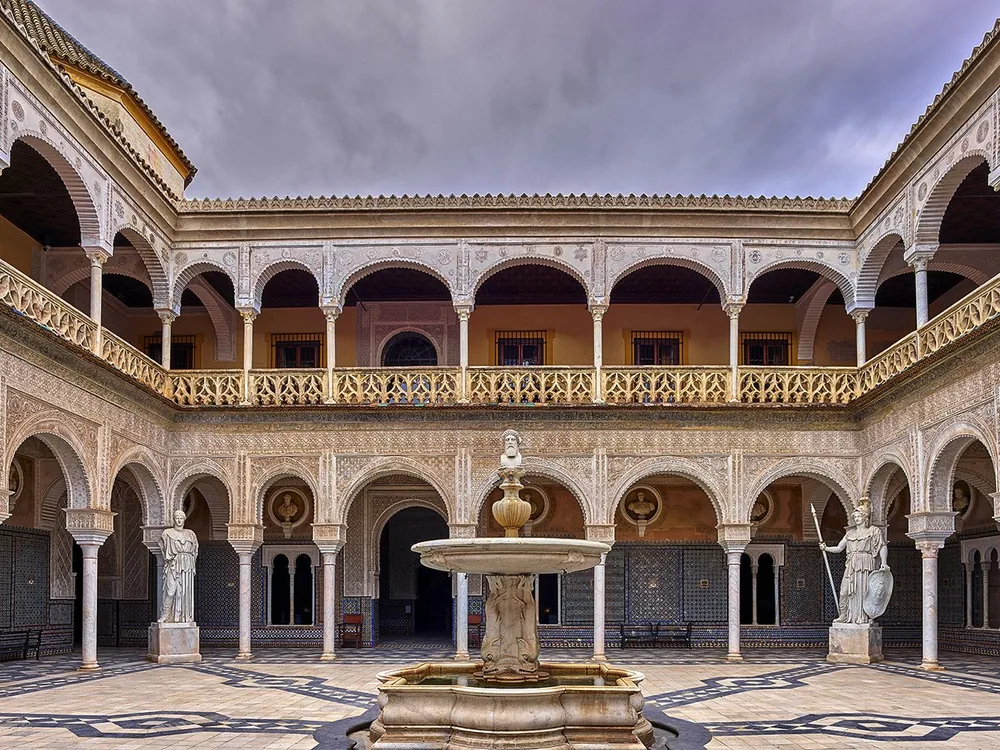The Patio Principal of Casa de Pilatos with its Mudéjar azulejo tilework and Plateresque arches, Seville