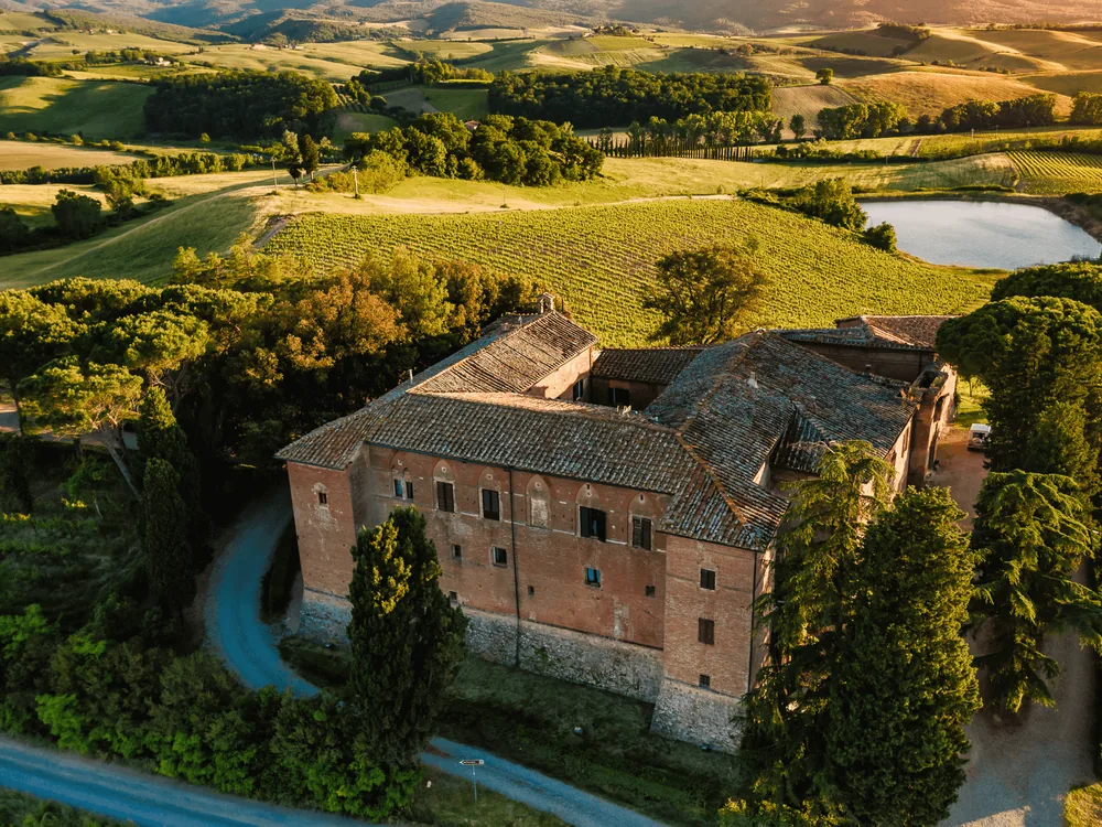 Castello Tricerchi in the Brunello di Montalcino vineyards — the Templar-founded medieval castle at Località Altesi, Montalcino, in the Val d'Orcia UNESCO landscape of southern Tuscany