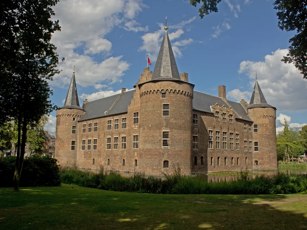 Kasteel Helmond rising above its original water-filled moat in the centre of Helmond, North Brabant — one of the Netherlands' best-preserved 14th-century square-plan moated castles