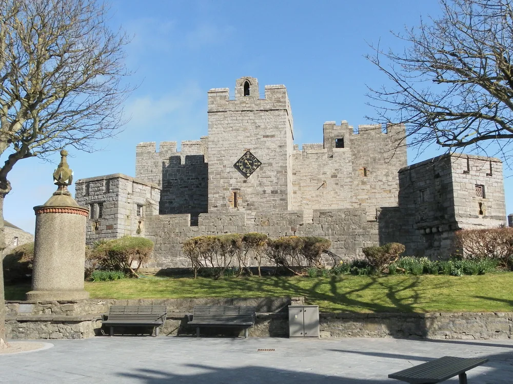 Castle Rushen in Castletown, Isle of Man — one of Europe's best-preserved medieval castles, the Norse-founded seat of the Kings of Mann, with its limestone keep and battlements overlooking Castletown harbour and the Irish Sea
