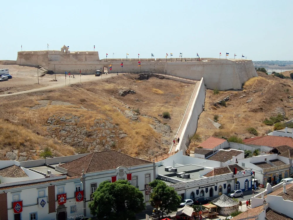 Castro Marim Castle on its hilltop above the Rio Guadiana salt marshes in the eastern Algarve, with the Fort of São Sebastião visible on the neighbouring hill