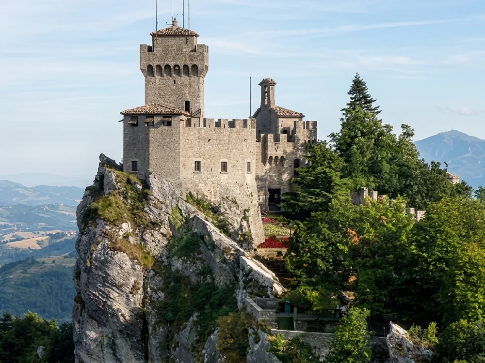 Cesta Tower (Second Tower) on the highest peak of Mount Titano in San Marino — the 13th-century medieval fortress housing the Museum of Ancient Weapons, with views over the Emilia-Romagna plain and the Adriatic coast