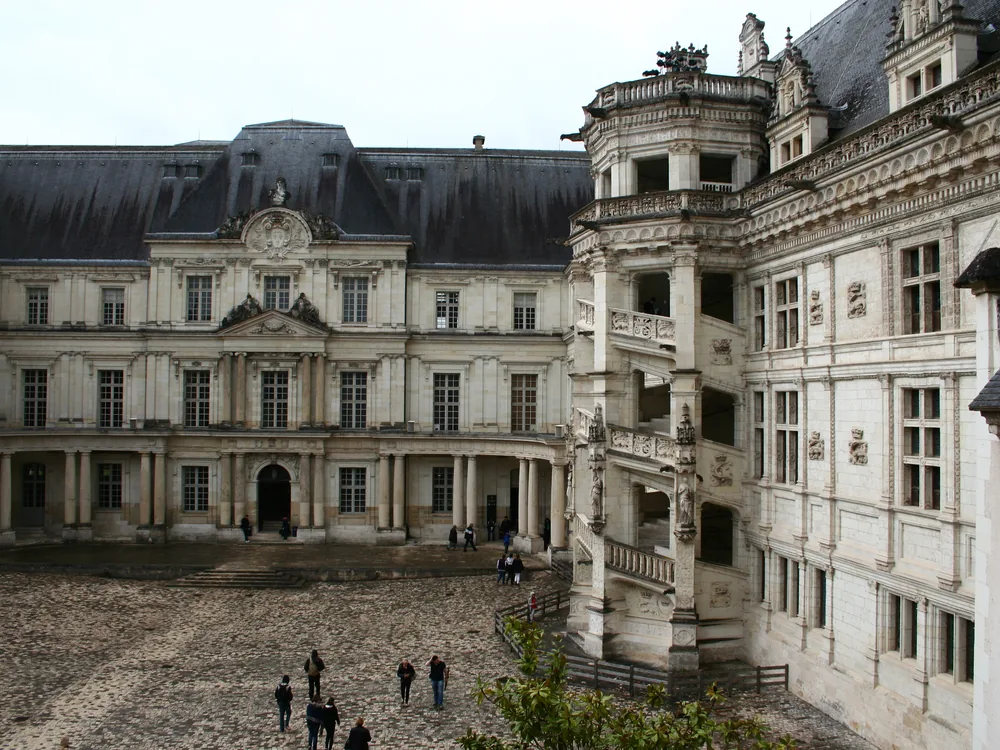 The François I wing of Château de Blois with its famous spiral staircase and Renaissance loggia facade facing the courtyard
