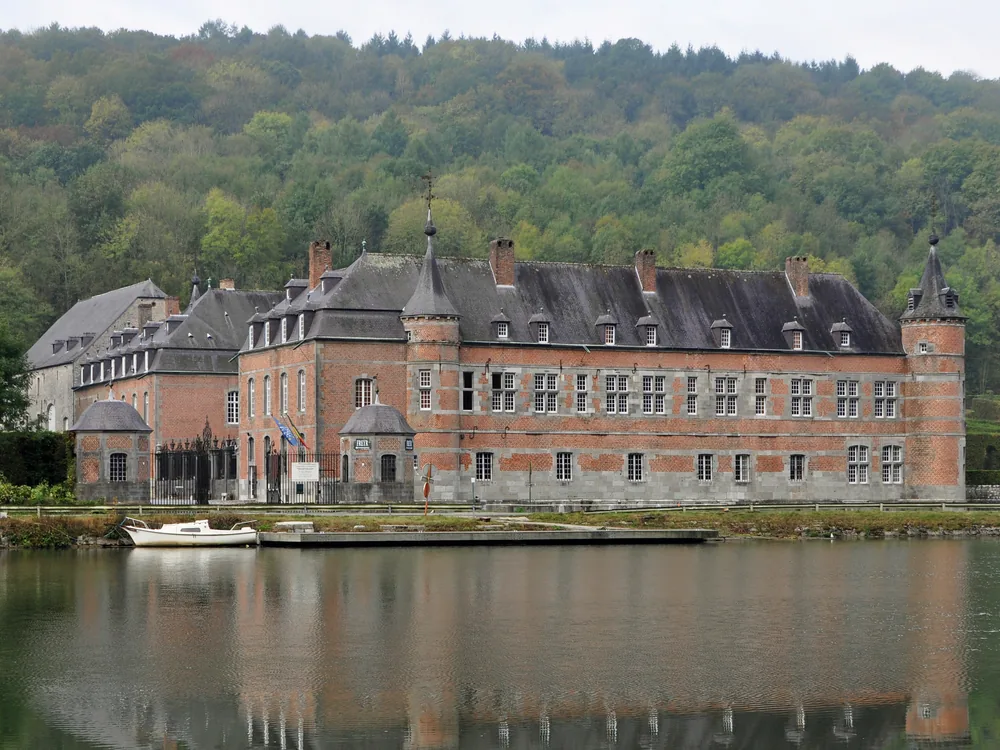 Château de Freÿr and its 18th-century French formal gardens descending in terraces to the Meuse River in Wallonia, Belgium — the finest surviving Le Nôtre-tradition gardens in the Belgian Meuse valley