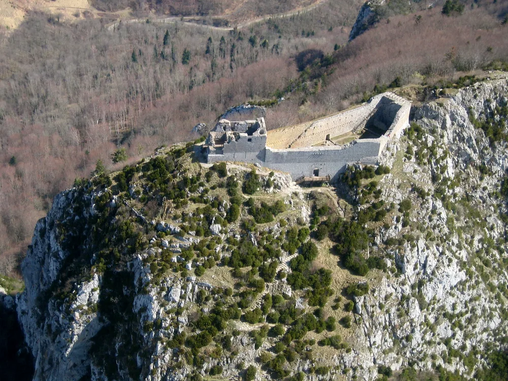 Château de Montségur ruins perched on a rocky pog above the Ariège valley in the Pyrenean foothills
