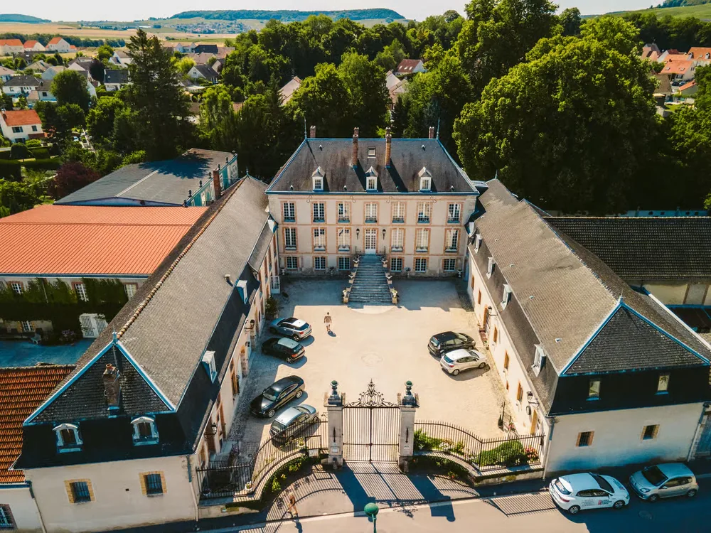 Château de Pierry in the Champagne wine country near Épernay — the 18th-century limestone manor and its vineyards on the Côte des Blancs
