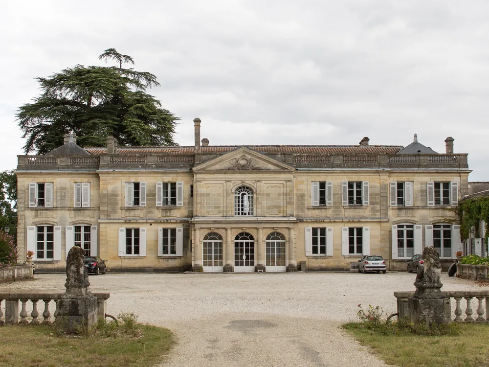 Château du Taillan — the classical 18th-century Médoc wine château and its heritage cellars, four generations in the Cruse family