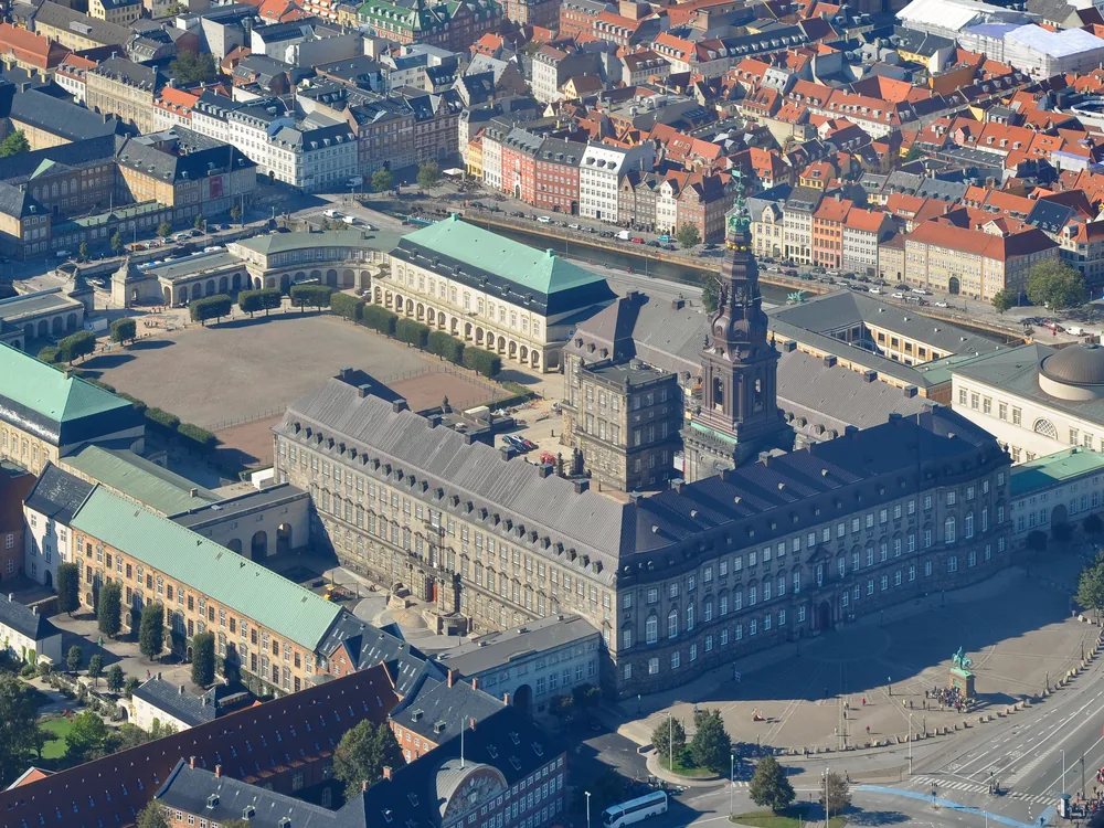 Christiansborg Palace's Neo-Baroque tower rising above Slotsholmen island in Copenhagen