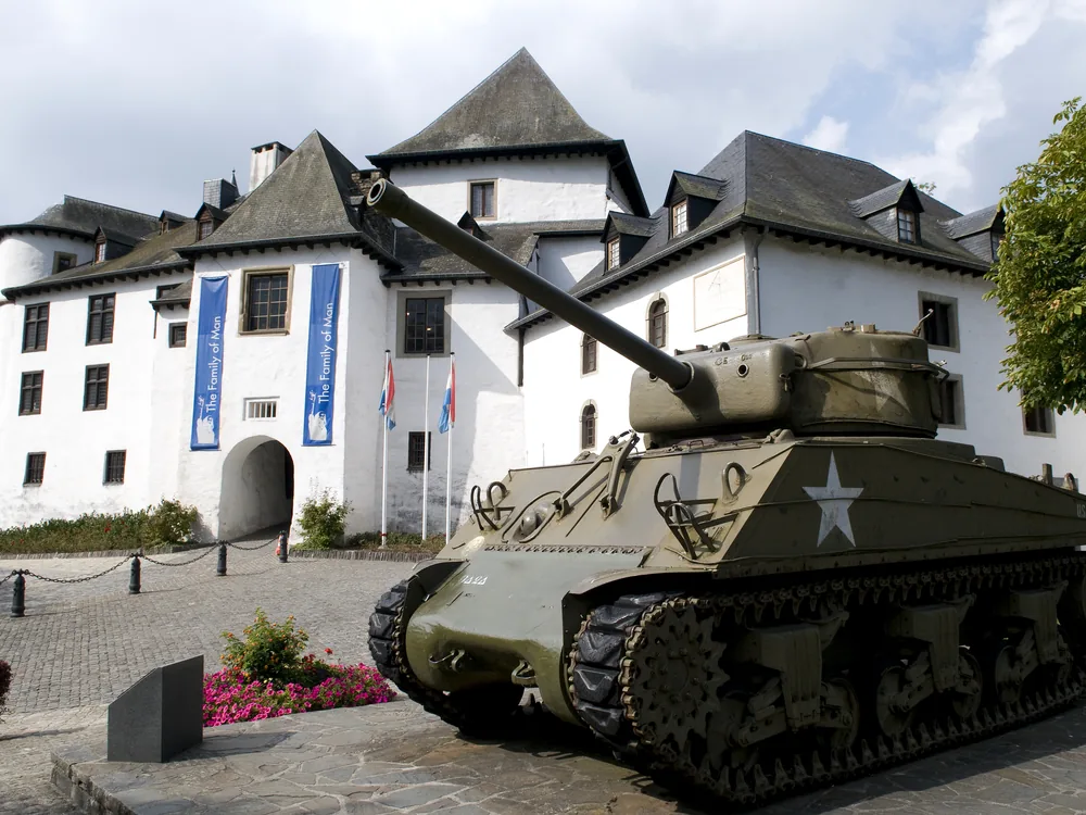 Clervaux Castle overlooking the town in a loop of the Clerve river in northern Luxembourg, rebuilt after near-total destruction in the Battle of the Bulge