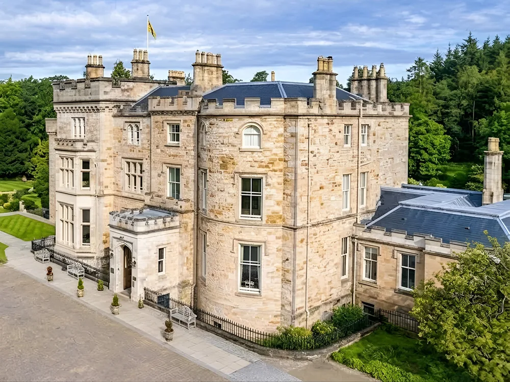Crossbasket Castle near Glasgow, Scotland, a restored 15th-century tower paired with a new Art Deco wing