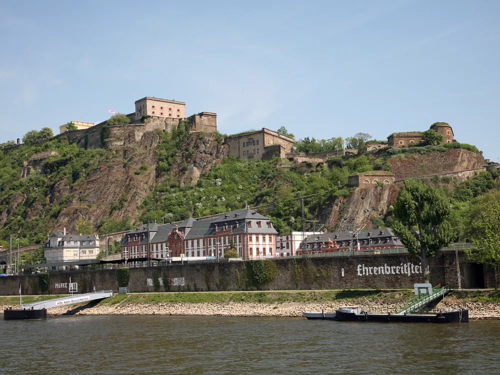 Ehrenbreitstein Fortress — the massive Prussian fortress on its 118-metre plateau above the Rhine-Moselle confluence at Koblenz, with the Deutsches Eck visible below, Rhineland-Palatinate, Germany