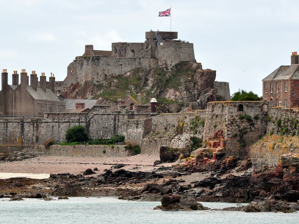Elizabeth Castle on the tidal islet of L'Islet in Saint Helier Bay, Jersey — the 16th-century artillery fortress accessible by stone causeway at low tide or DUKW amphibious ferry at high tide, Jersey, Channel Islands