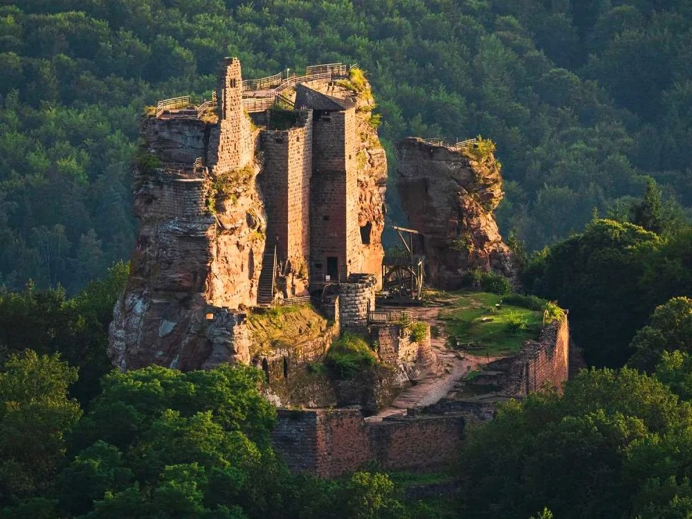 Fleckenstein Castle ruins on the sandstone spur above the Vosges du Nord forest near Lembach, Alsace — the 12th-century castle with staircases carved into the living Buntsandstein rock