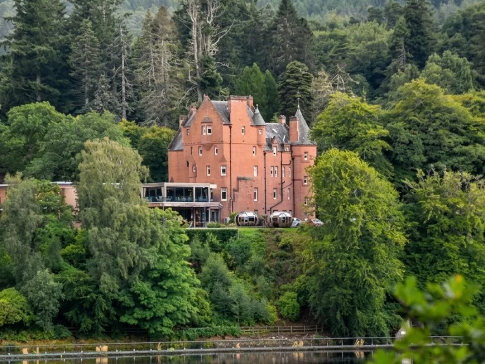 Fonab Castle on the shore of Loch Faskally in Pitlochry, Scotland, a Scots Baronial mansion now Pitlochry's only 5-star hotel