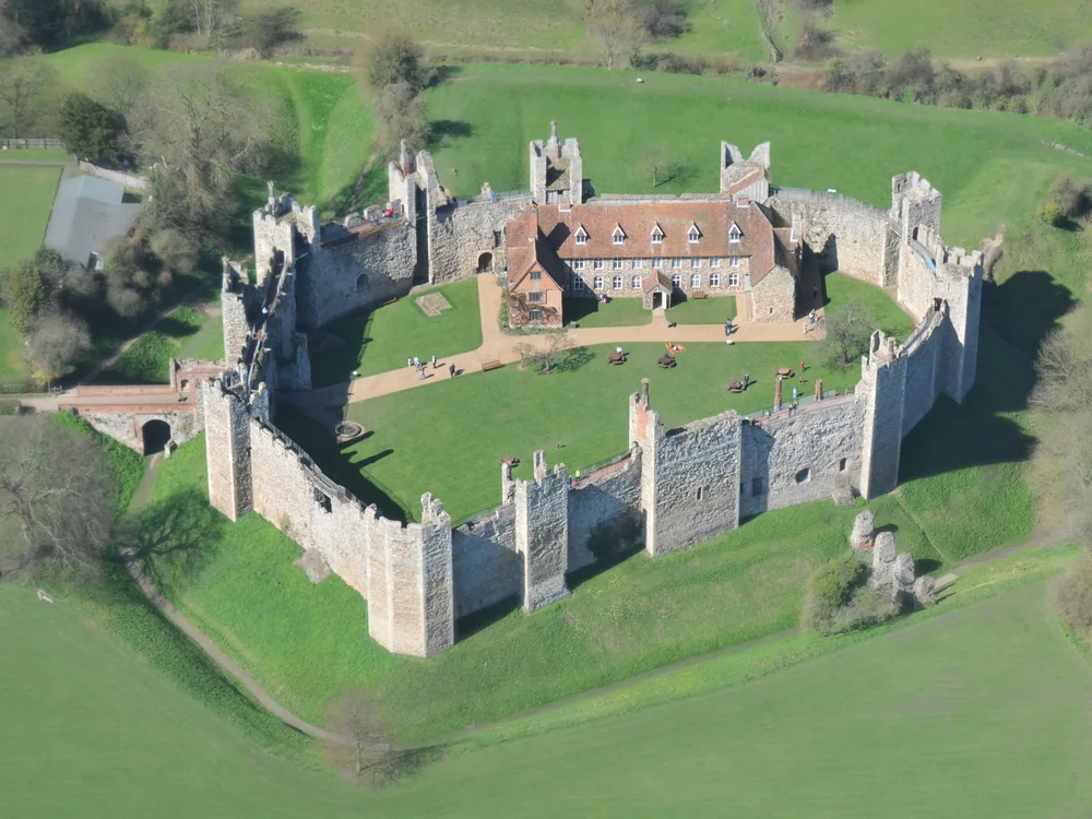 Framlingham Castle curtain wall and 13 towers in Suffolk — the English Heritage castle where Mary Tudor rallied her army in 1553, built without a central keep in an unusual 12th-century design