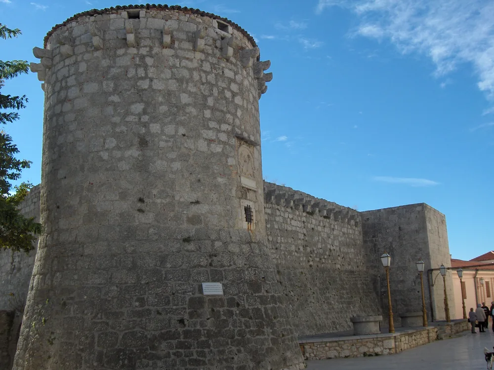Frankopan Castle — the medieval round tower of the Frankopan dynasty overlooking Krk Town harbour on the island of Krk, Kvarner Bay, Croatia