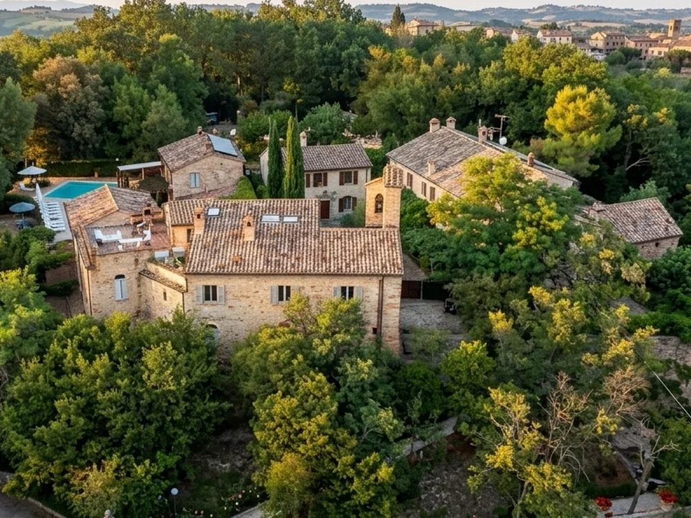 Granarola Castle, a restored 13th-century fortress near Gradara, Marche, Italy, with residences including one carved into ancient grain-storage caves