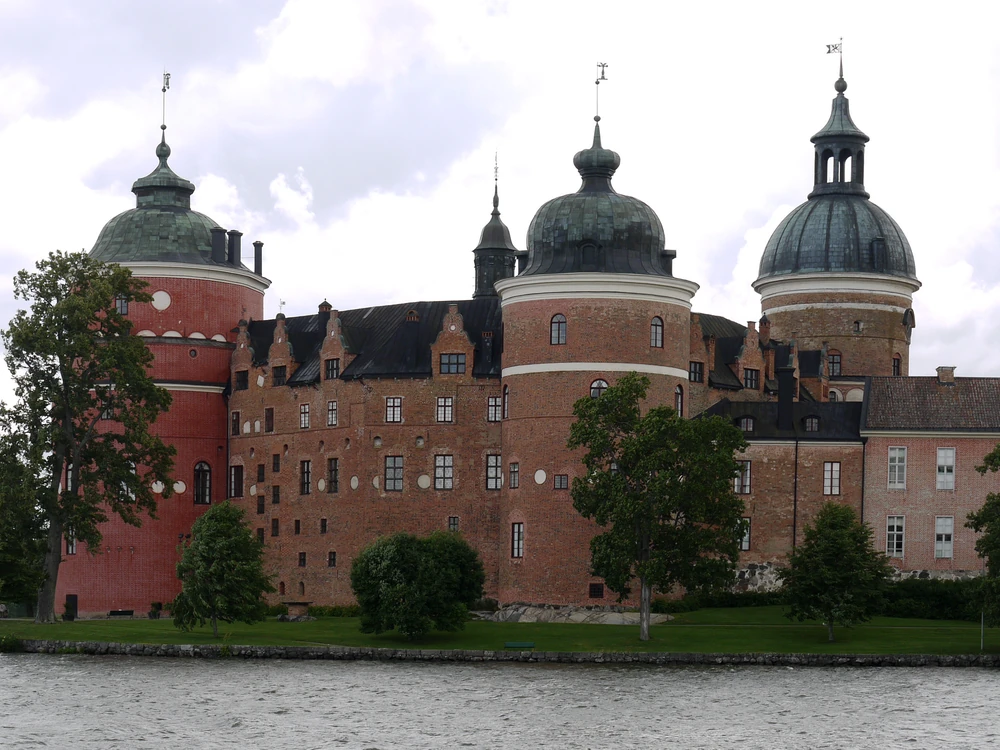 Gripsholm Castle's round towers reflected in Lake Mälaren, Mariefred, Sweden