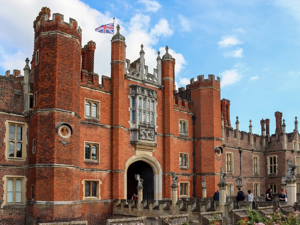 Hampton Court Palace's Tudor gatehouse and Baroque wings beside the Thames, Greater London