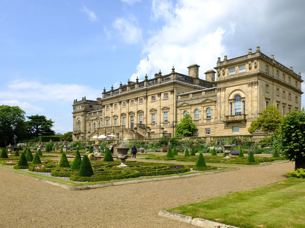 Harewood House south facade reflected in the Capability Brown lake, West Yorkshire
