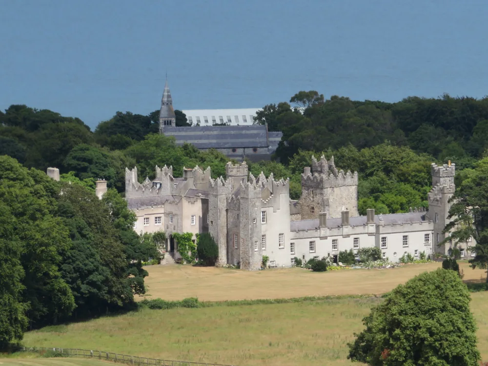 Howth Castle on the Howth Peninsula north of Dublin — the private St Lawrence family estate occupied continuously since 1235, surrounded by rhododendron gardens and above Dublin Bay