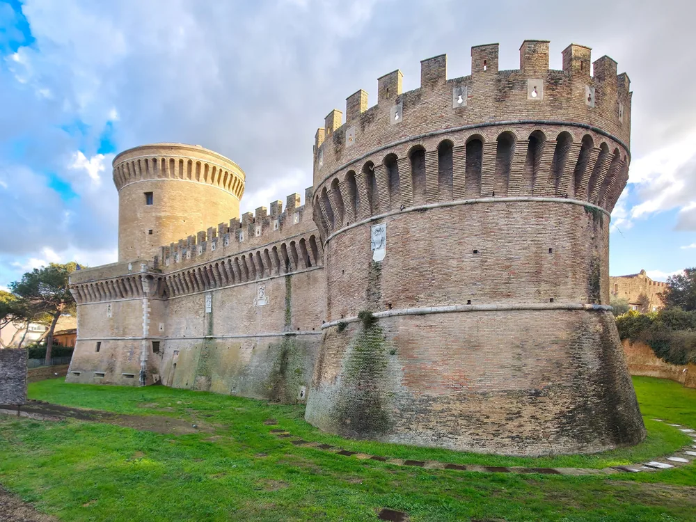 Julius II Castle (Castello di Giulio II) in Ostia Antica, Rome — the Renaissance papal fortress built 1483–1503 at the mouth of the Tiber River, in the cobbled medieval Borgo di Ostia Antica, Lazio, Italy