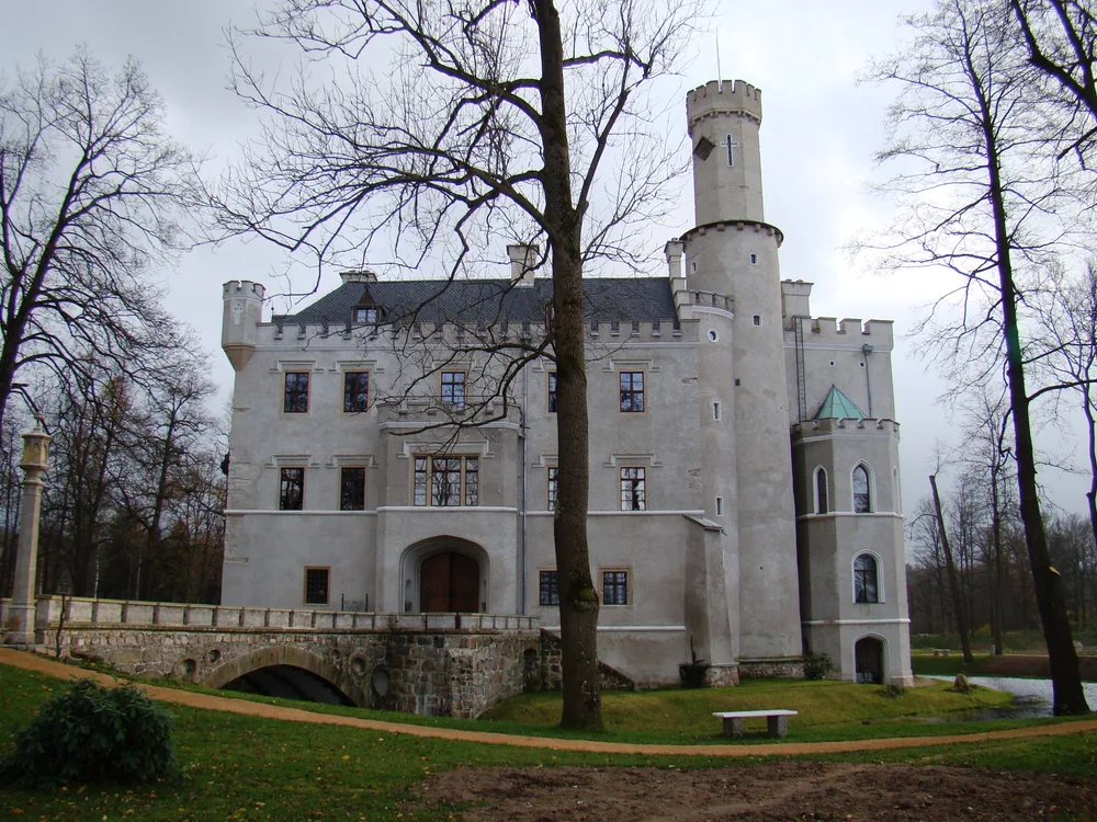 Karpniki Castle (Schloss Fischbach) in the Jelenia Góra Valley, Lower Silesia, Poland — a moated neo-Gothic former Hohenzollern summer retreat