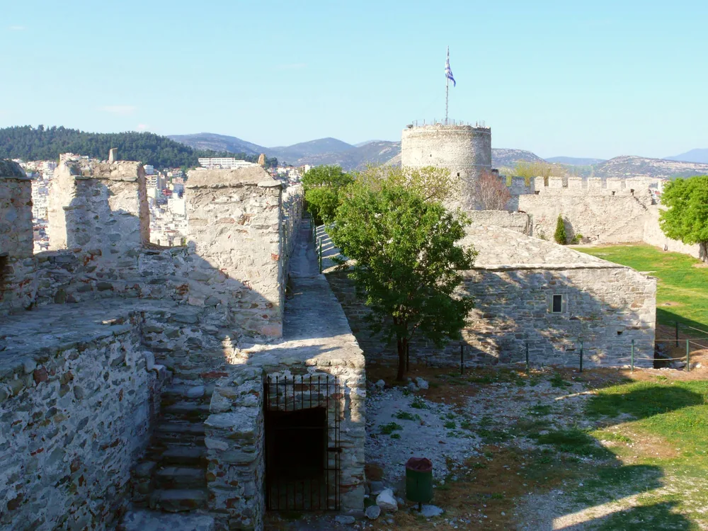 Kavala Fortress on the acropolis hilltop above the Panagia old town quarter and harbour in Kavala, northeastern Greece — the Byzantine-origin Ottoman fortress with walls and towers overlooking the Kavala Gulf