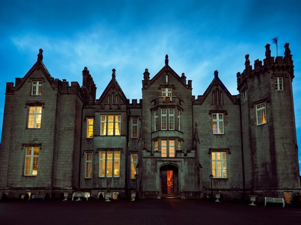 Kinnitty Castle in the Slieve Bloom Mountains, County Offaly, Ireland, a Gothic Revival castle beside a medieval abbey site