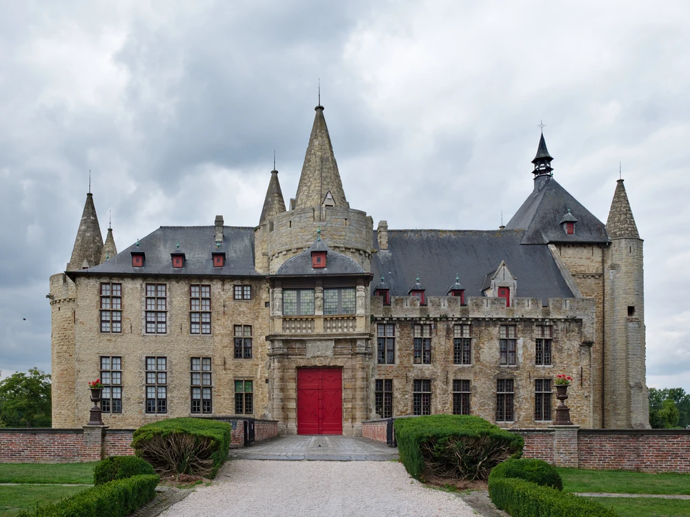 Laarne Castle reflected in its water moat, East Flanders, Belgium