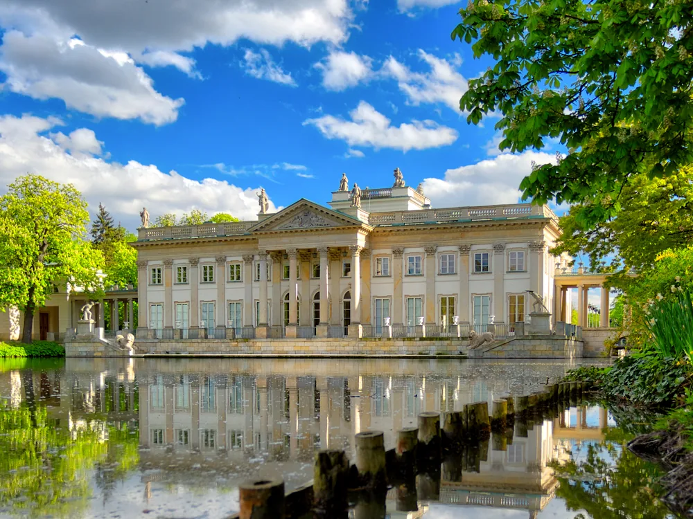 Łazienki Palace (Palace on the Isle) — the neoclassical water palace of Poland's last king Stanisław August Poniatowski, reflected in the lake of Łazienki Royal Park, Warsaw, Poland