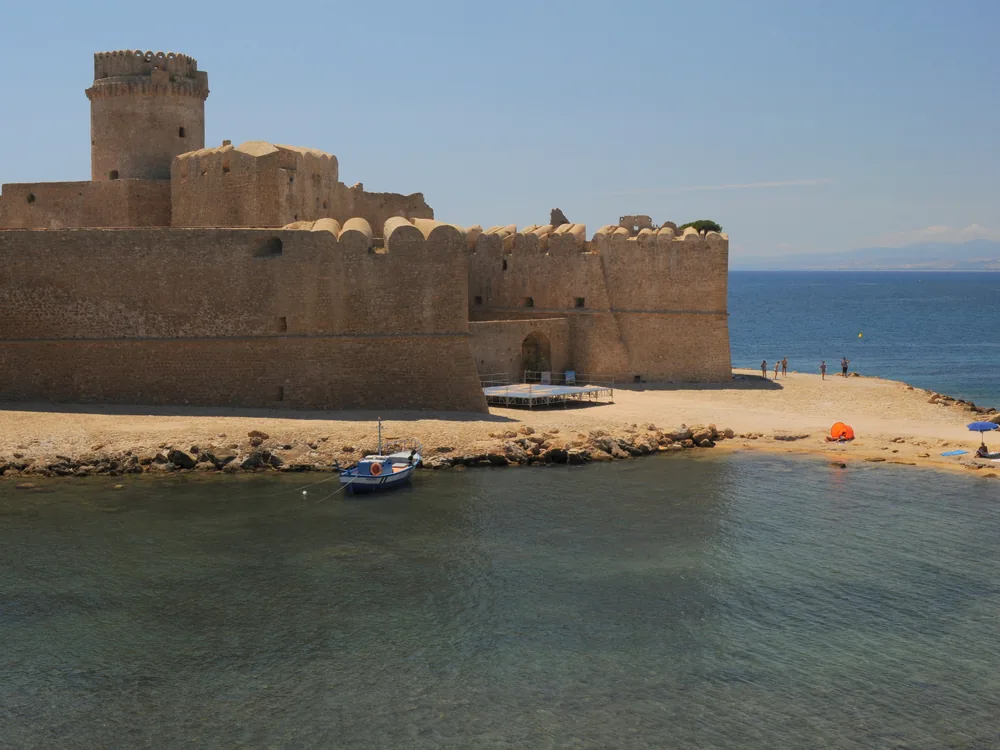Le Castella Fortress (Castello Aragonese di Le Castella) on its tidal islet above the Ionian Sea, Calabria — a 2,500-year-old fortified site on the Capo Rizzuto coast