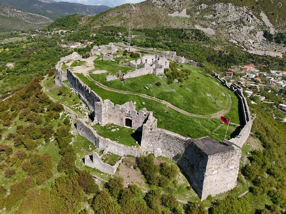 Lezhë Castle on its hilltop above the Adriatic coastal plain — where Skanderbeg formed the League of Lezhë in 1444 and died in 1468