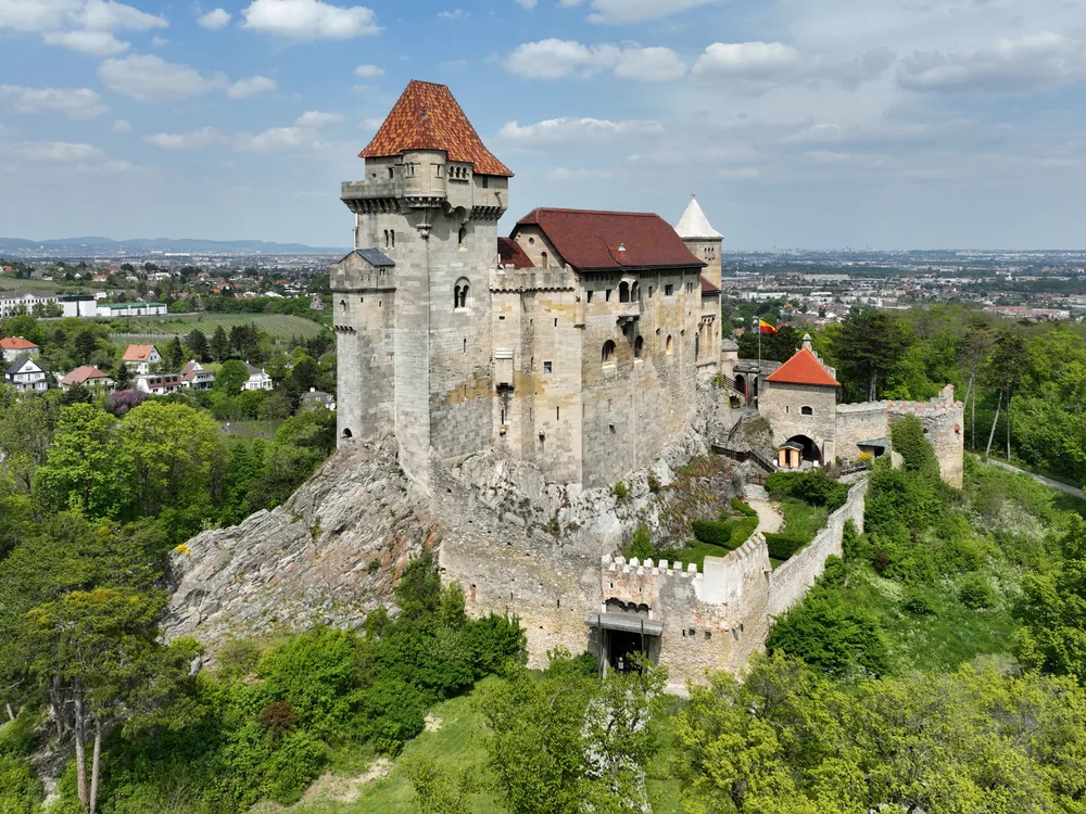 Liechtenstein Castle (Burg Liechtenstein) on its hilltop in the Wienerwald, Maria Enzersdorf, Lower Austria — the 12th-century ancestral seat of the House of Liechtenstein, rebuilt in Gothic Revival style 1808–1816
