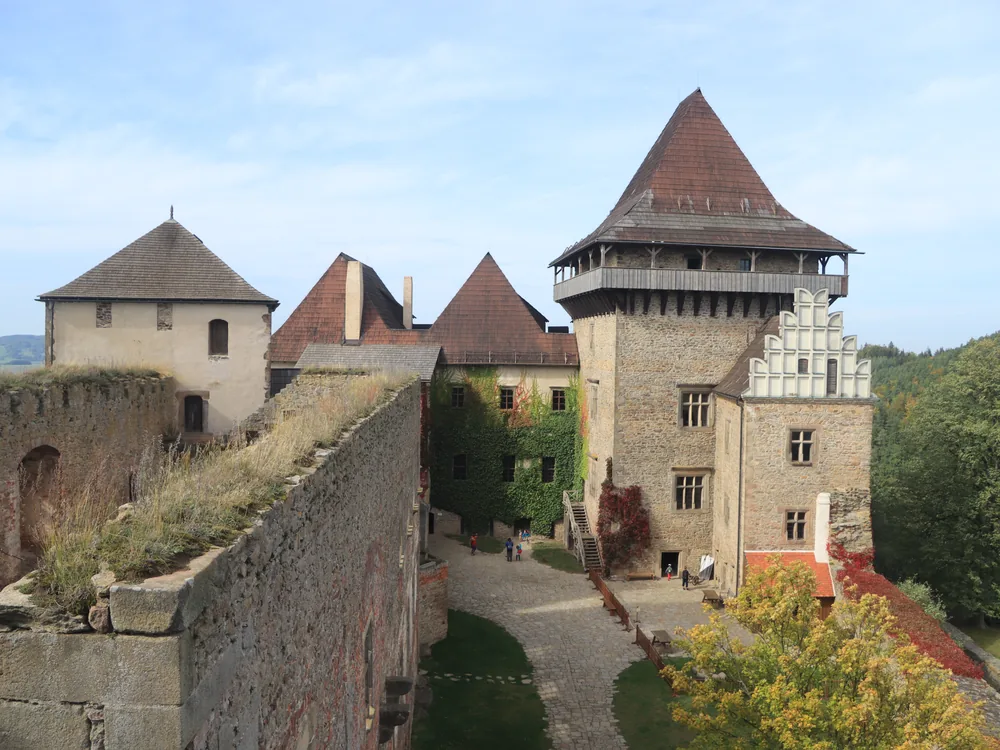 Lipnice Castle (Hrad Lipnice) ruins above the village of Lipnice nad Sázavou, Vysočina Region, Czech Republic — the Samson Tower and Gothic fortification walls above the Sázava river valley, the site of Jaroslav Hašek's final years