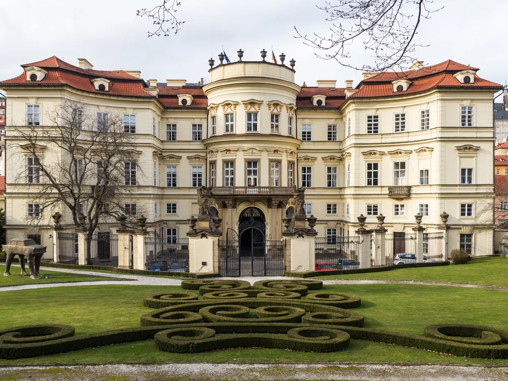 Lobkowicz Palace's Baroque façade at the eastern end of Prague Castle, with the city of Prague spread below the castle hill