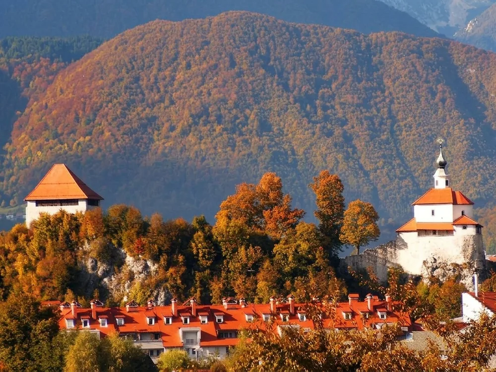 Mali Grad Castle ruins on the hill above Kamnik with the Kamnik-Savinja Alps in the background, central Slovenia