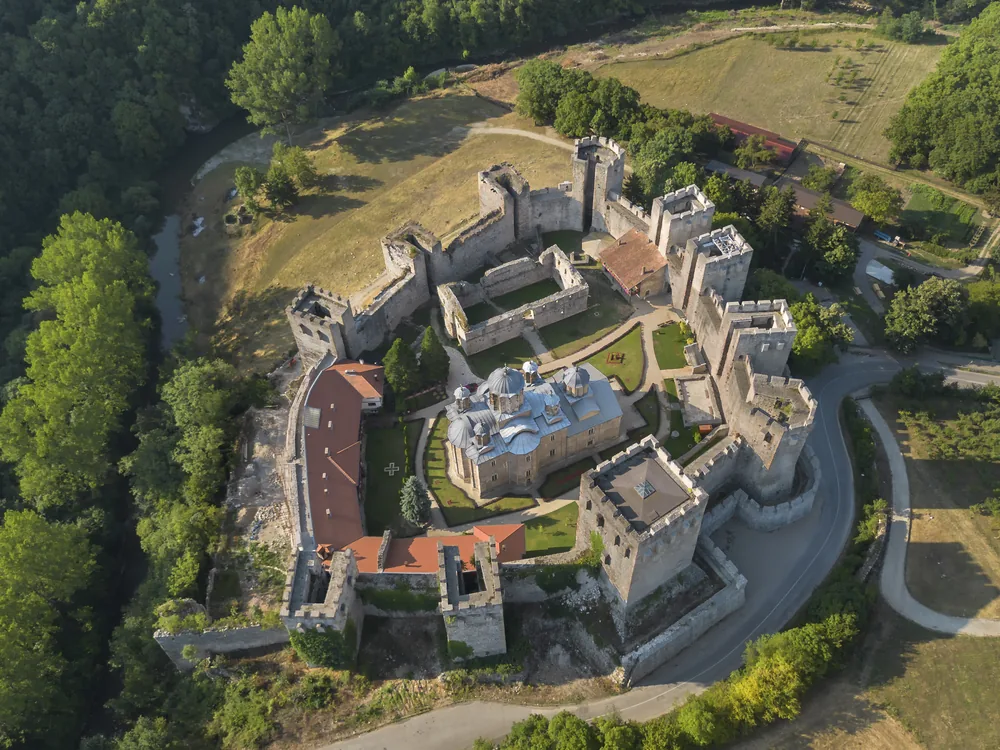 Manasija Monastery (Resava) in the Resava Valley, Serbia — the 1407–1418 fortified monastery of Despot Stefan Lazarević, the finest example of Morava School architecture, with eleven defensive towers enclosing the Church of the Holy Trinity