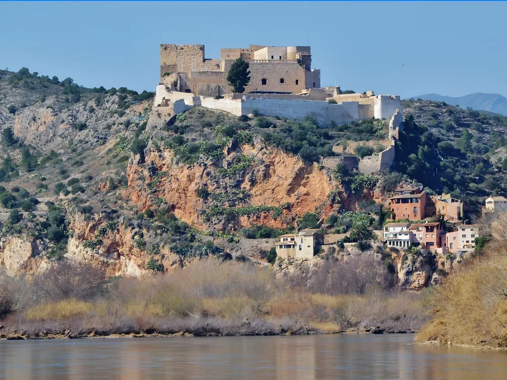 Miravet Castle — the Knights Templar fortress on its limestone cliff above the Ebro river in the Ribera d'Ebre comarca, Tarragona
