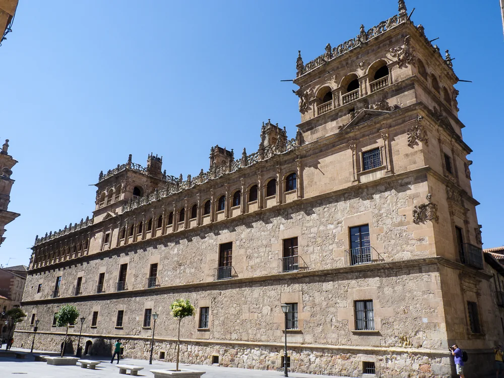 Palacio de Monterrey (Monterrey Palace) in Salamanca — the Plateresque facade with its ornate arcade gallery, crestería roofline, and corner towers, built 1539, Castile and León, Spain