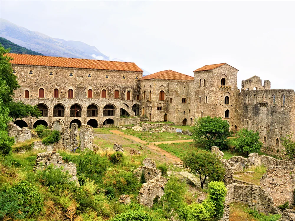 Mystras — the abandoned Byzantine hill city in the Peloponnese, Greece, with the castle at the summit and the churches and monastery walls of the Despotate of Morea visible on the slopes below, UNESCO World Heritage Site