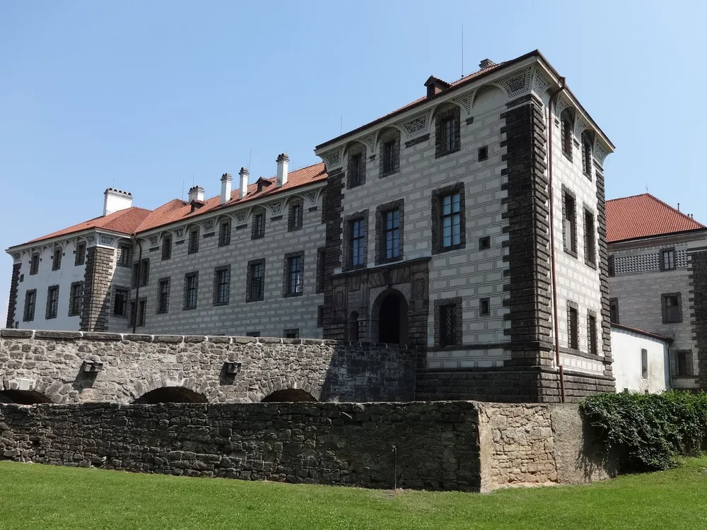 Nelahozeves Castle above the Vltava River — the Lobkowicz family's Renaissance castle with sgraffito facade, housing one of Central Europe's finest private art and music manuscript collections
