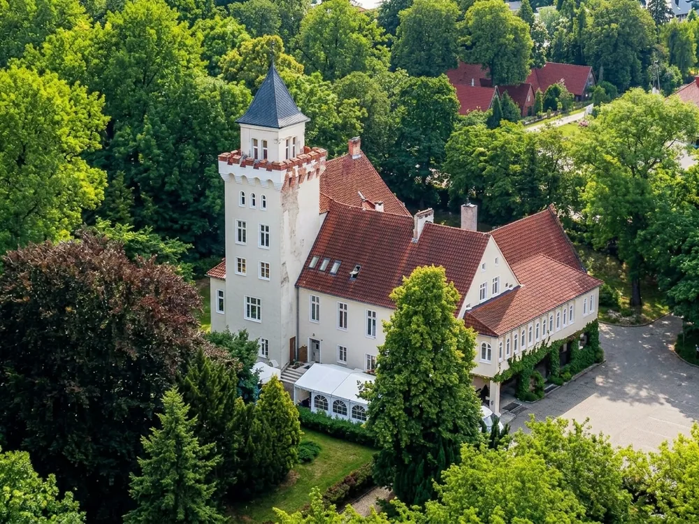 Nowęcin Castle beside Lake Sarbsko near Łeba, Pomerania, Poland — a residence founded after the 1497 storm surge, now a hotel