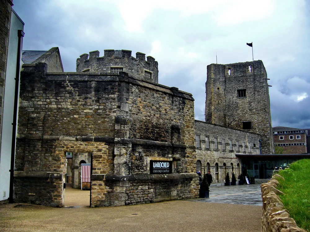 Oxford Castle and Prison — St George's Norman Tower rising above the 18th and 19th-century prison buildings in central Oxford, housing nearly 900 years of incarceration history