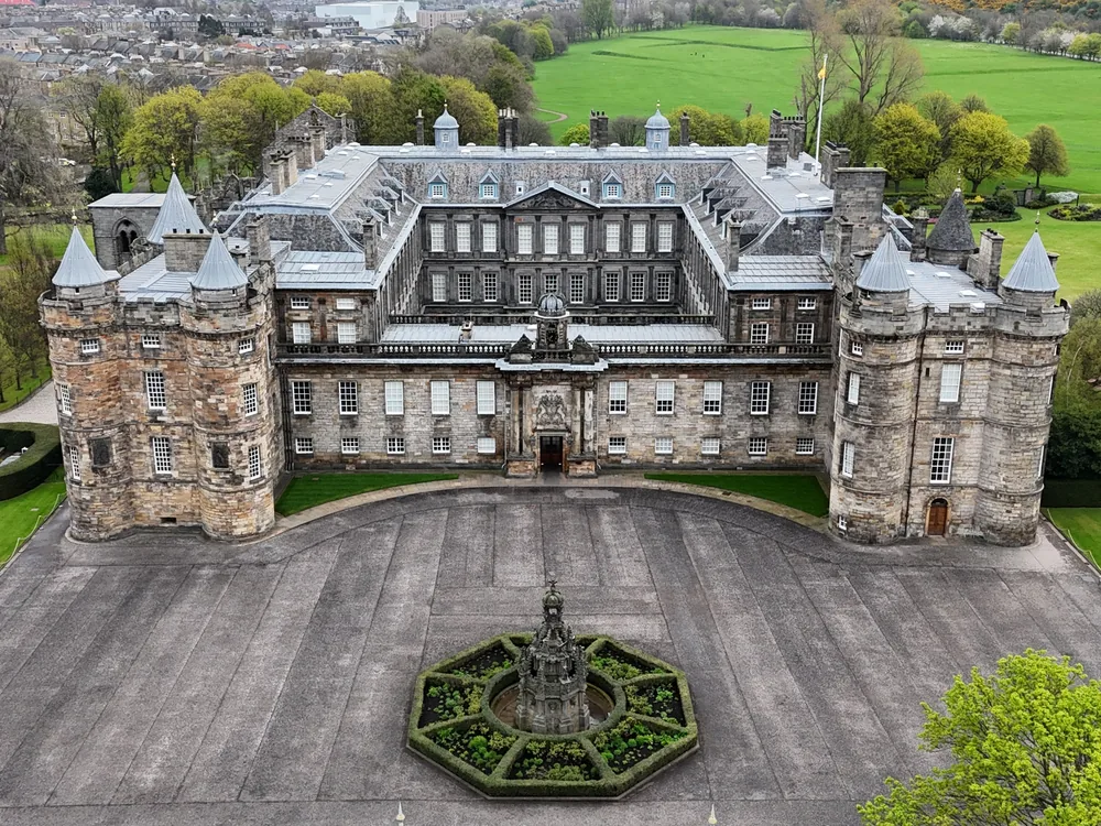The Palace of Holyroodhouse with the ruined Holyrood Abbey nave in its forecourt, Edinburgh
