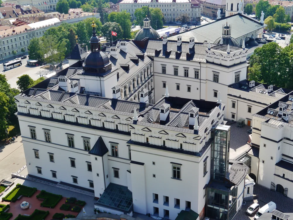 Palace of the Grand Dukes of Lithuania on Cathedral Square in Vilnius — the reconstructed Renaissance and Baroque royal palace of the Grand Duchy, with the Cathedral Basilica and Gediminas Tower visible in the background