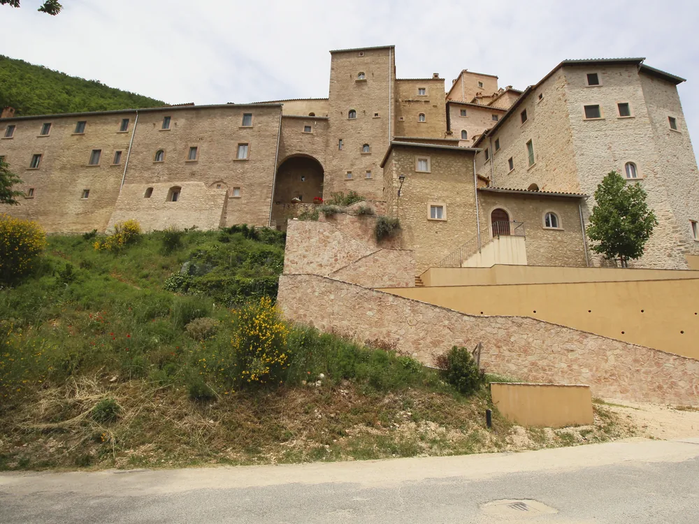 Postignano Castle, a restored medieval hamlet in Umbria's Vigi Valley, Italy, abandoned in 1963 and restored from 1994