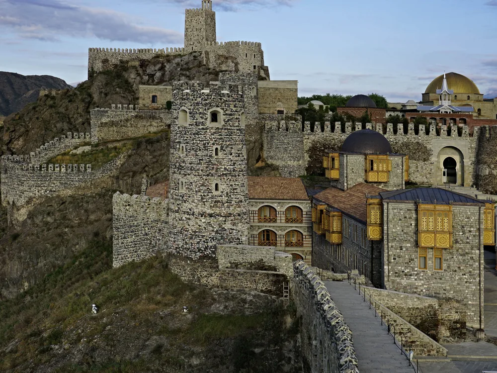 Rabati Castle in Akhaltsikhe, Georgia — the 2011–2012 reconstructed fortress complex above the Mtkvari River, including the 1752 Hagia Sophia-inspired mosque with its minaret and the medieval towers