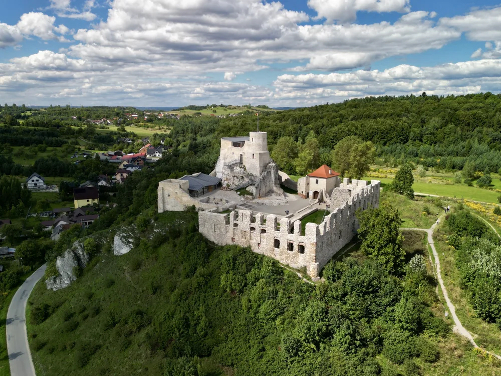 Rabsztyn Castle ruins on Rabsztyn Hill in the Polish Jurassic Highland — three-tier medieval royal stronghold with upper, middle, and lower castle sections, 45 km northwest of Kraków, conservation reopened 2015